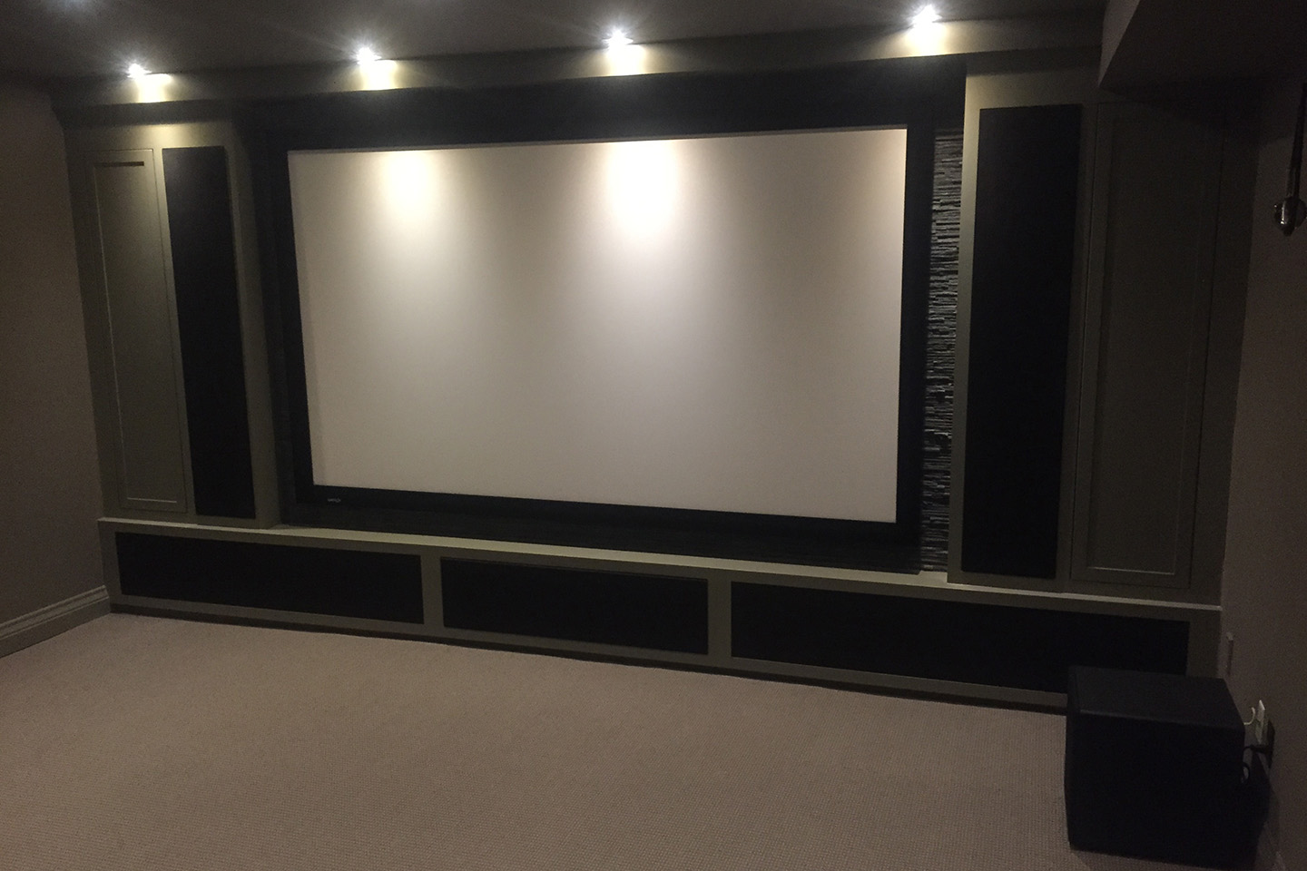 On Wall Projection Screen with Custom Cabinetry for Speakers