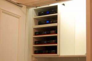 5 Tier Custom Home Audio Shelving in Condominium closet