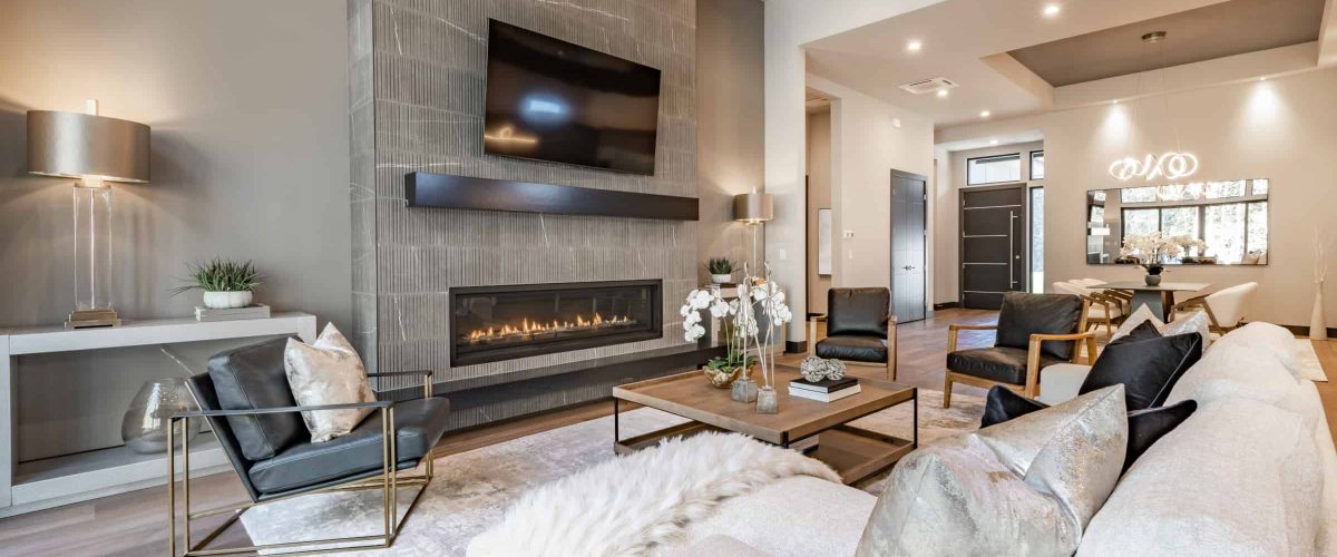 Tv wall mounting service showcasing a Samsung TV above a fireplace in family room